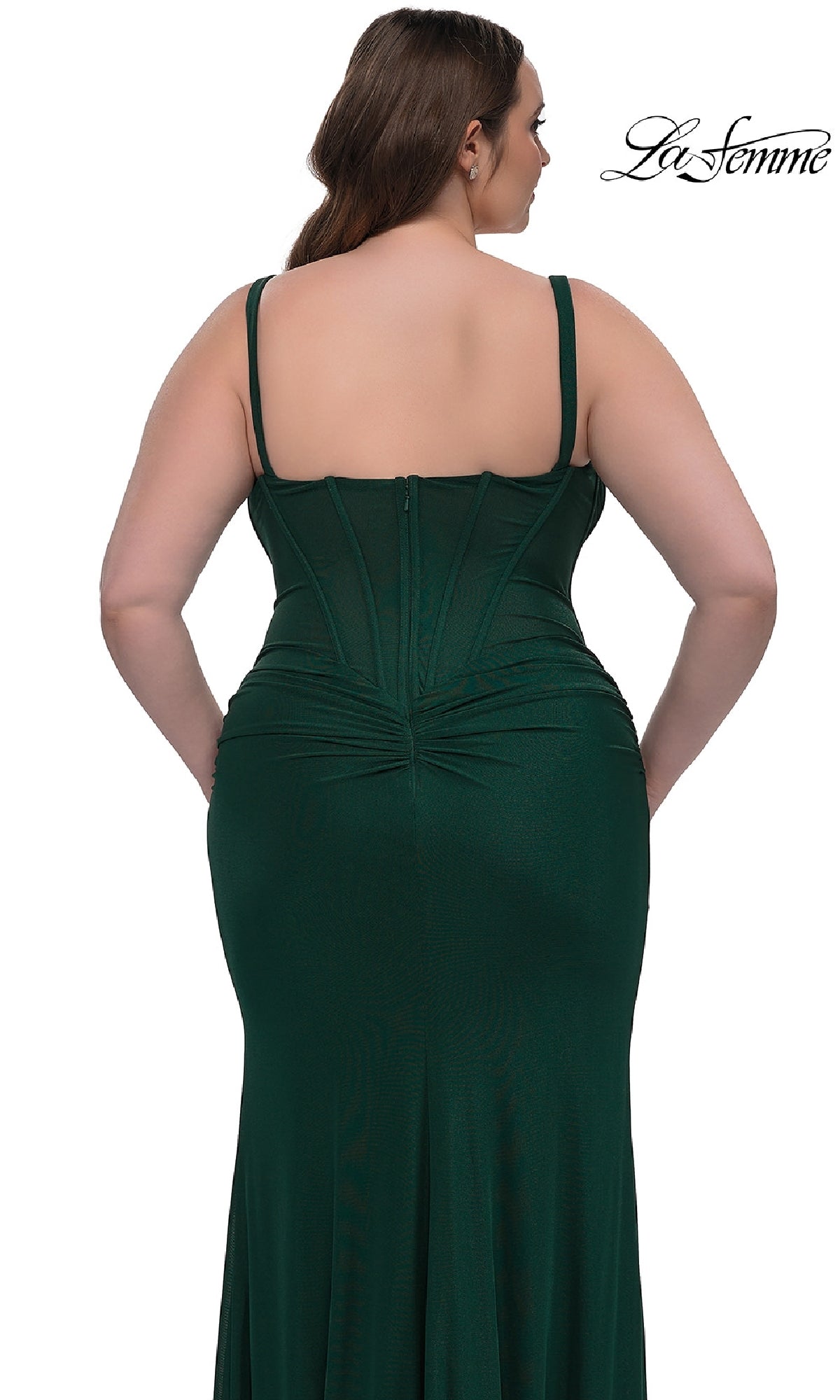 A woman is shown from the back wearing the Plus-Size Long Corset Prom Dress: La Femme 33015, a dark green fitted sleeveless formal gown with visible seam details and a zipper closure.